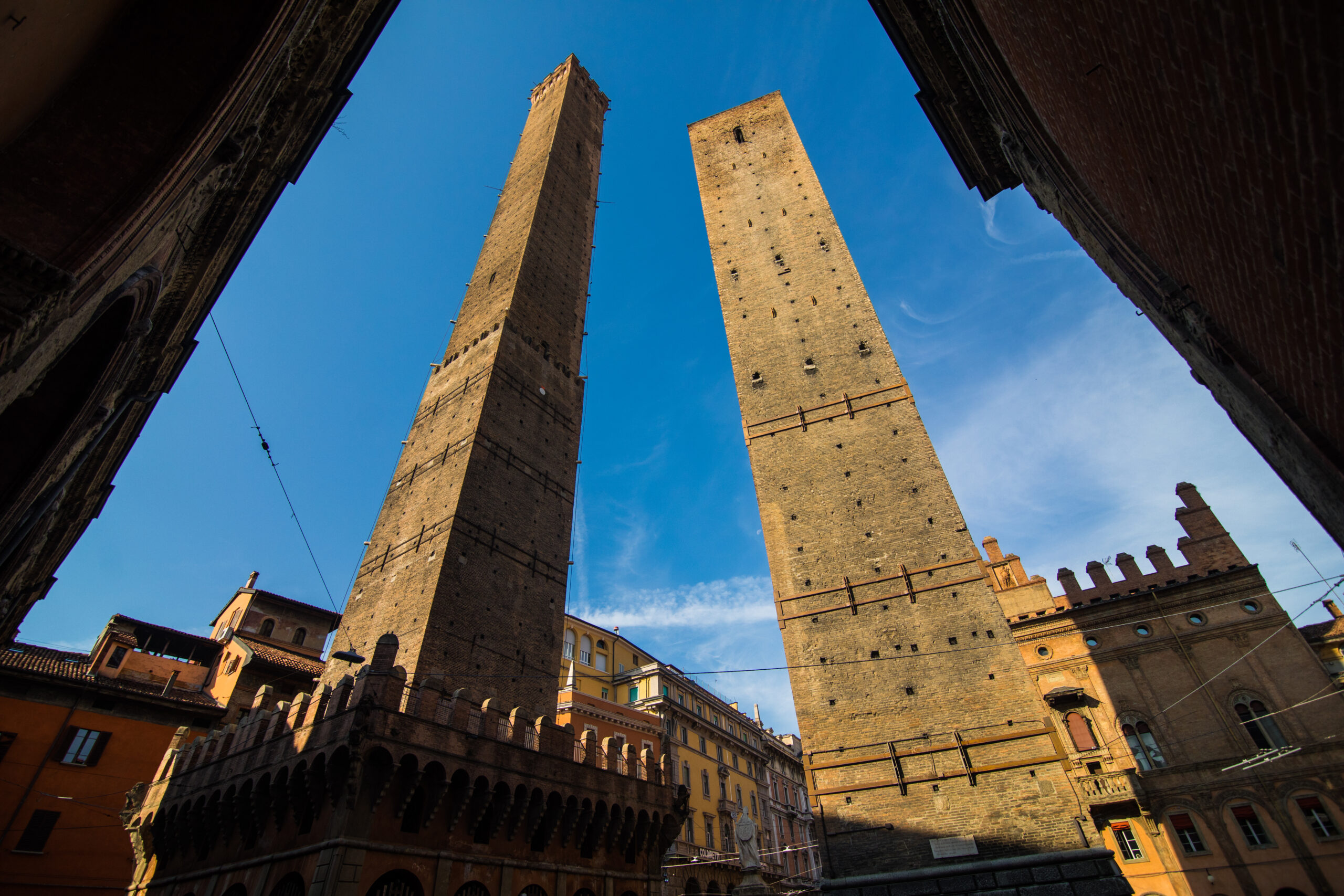 Two famous falling towers Asinelli and Garisenda in the morning, Bologna, Emilia Romagna, Italy